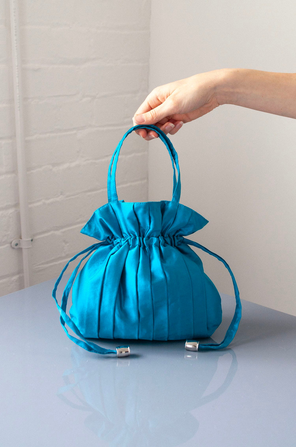 Dollis Goods Drawstring bag Occasion Bag in Aqua Blue