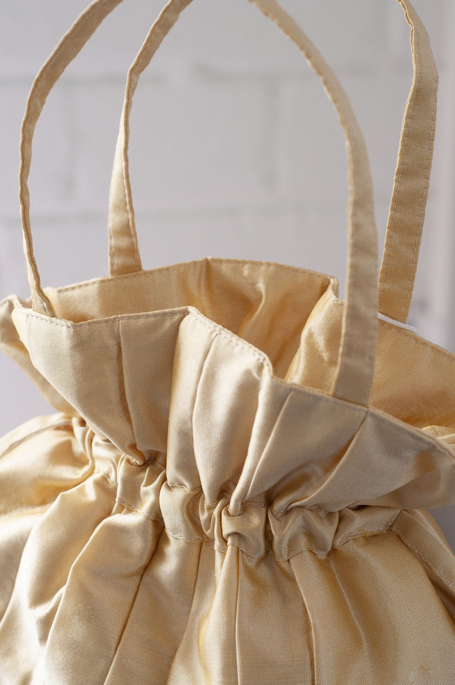 Dollis Goods Drawstring bag Occasion Bag in Butter Yellow
