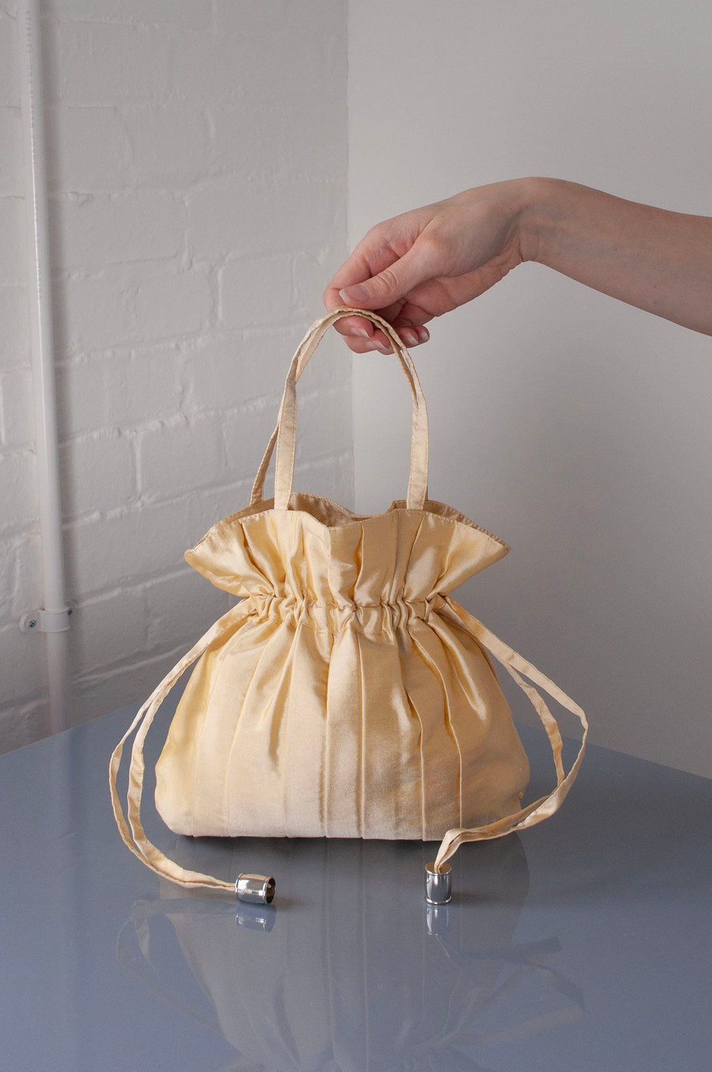 Dollis Goods Drawstring bag Occasion Bag in Butter Yellow