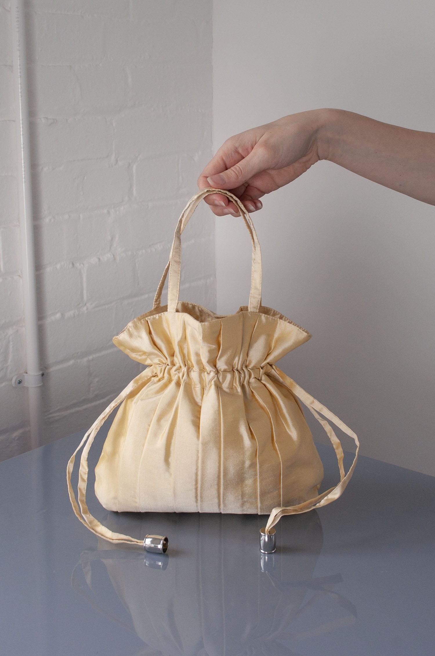 Dollis Goods Drawstring bag Occasion Bag in Butter Yellow
